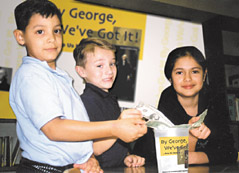 Ismael Rosas, Charles Rhinehart, and Marielly Garza (left to right) from Sparks Elementary School in Pasadena, Texas catch the spirit and contribute to the “By George We’ve Got it Campaign” campaign.